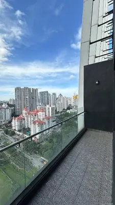 a balcony of a building with a view of a city at 2BR 4PAX Stylish Duplex ARTE Mont Kiara in Kuala Lumpur