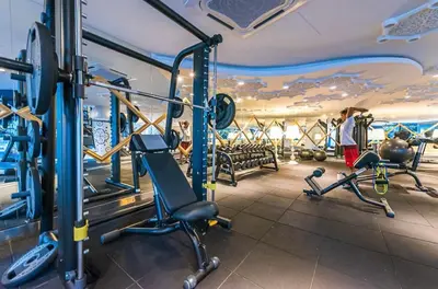 a gym with cardio equipment in a hotel room at 2BR 4PAX Stylish Duplex ARTE Mont Kiara in Kuala Lumpur