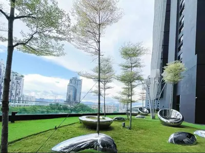 a park with trees in a city with buildings at 2BR 4PAX Stylish Duplex ARTE Mont Kiara in Kuala Lumpur
