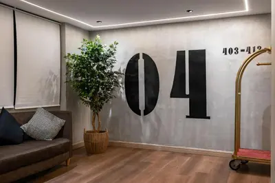 a lobby with a wall with the number on it at BRYQS Hotel KL Sentral in Kuala Lumpur