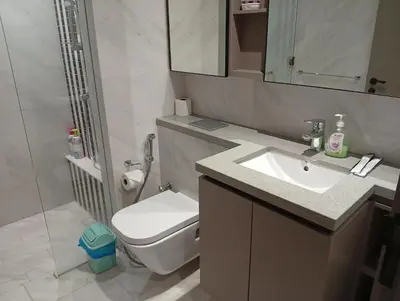 a bathroom with a toilet and a sink and a shower at Eaton Residences KLCC By ARBAN in Kuala Lumpur