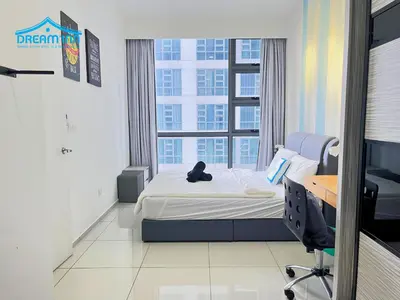 a bedroom with a bed and a desk and a chair at The Robertson Bukit Bintang KLCC by Dream'Inn in Kuala Lumpur