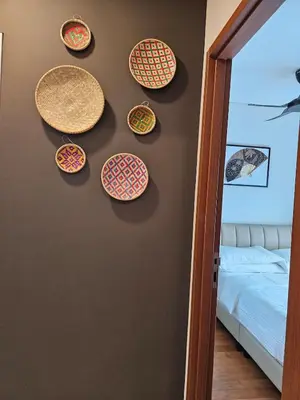 a room with plates hanging on a wall at Sky Suites KLCC Level 58 in Kuala Lumpur