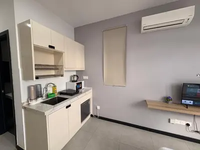 a white kitchen with a sink and a microwave at Luxury Studio - City View - LRT - KLCC - KL - Gleneagles in Kuala Lumpur