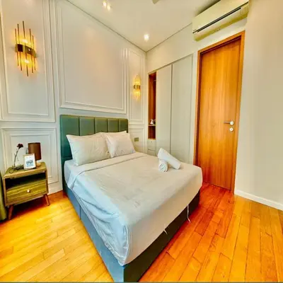 a bedroom with a large bed in a room at Sky suites klcc by Elham in Kuala Lumpur
