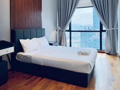 a bed in a room with a large window at Reizz by Aayu Residences - 10mins to KLCC, 2 mins to Gleneagles Hospital in Kuala Lumpur