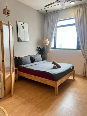 a bedroom with a bed with a teddy bear on it at Chambers Auroa Luxury Suites KLCC in Kuala Lumpur