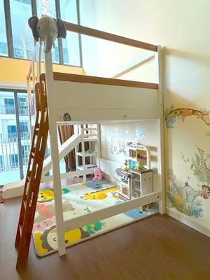a bunk bed with a ladder in a room at INFINITUM suites KLCC , infinity pool 360 view in Kuala Lumpur