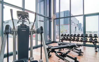 a gym with a row of exercise bikes at 3 Towers Jln Ampang by Airhost in Kuala Lumpur
