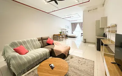 a living room with a couch and a table at 3 Towers Jln Ampang by Airhost in Kuala Lumpur