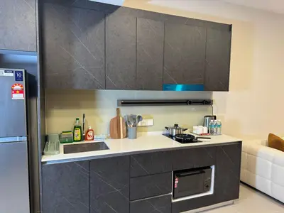 a kitchen with a sink and a stove top oven at The Atrium at Jalan Ampang by OKBnB - Classy Vibes 2Bedroom Apartment nearby KLCC , Pavilion & TRX in Kuala Lumpur