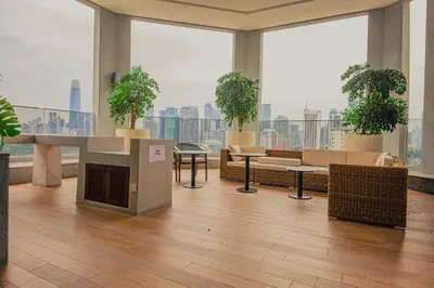 a large room with potted plants in a building at The Atrium at Jalan Ampang by OKBnB - Classy Vibes 2Bedroom Apartment nearby KLCC , Pavilion & TRX in Kuala Lumpur