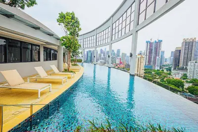 a hotel swimming pool with a view of a city at The Atrium at Jalan Ampang by OKBnB - Classy Vibes 2Bedroom Apartment nearby KLCC , Pavilion & TRX in Kuala Lumpur