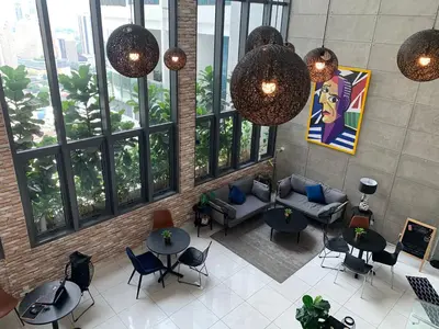 an overhead view of a lobby with furniture and windows at The Luxe by Infinitum Suites in Kuala Lumpur