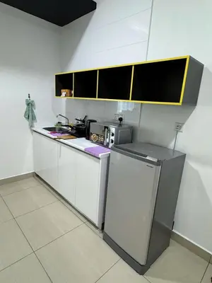a kitchen with white cabinets and a refrigerator at Comfy Arte Plus Ampang KL City 8 Pax-3BR-2CP in Kuala Lumpur