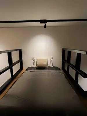 a bedroom with a large bed in a room at The Establishment Bangsar #26 by Ouki in Kuala Lumpur