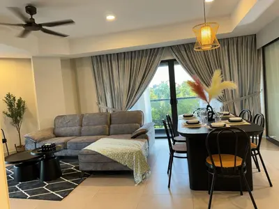 a living room with a couch and a table at The Atrium at Jalan Ampang by OKBnB - Classy 3Bedroom Family Suite nearby KLCC , TRX and Pavilion KL in Kuala Lumpur