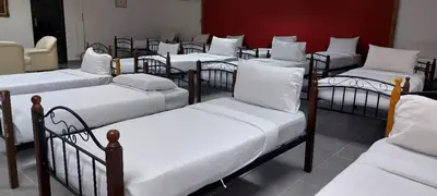 a group of beds sitting in a room at Kl Gateway in Kuala Lumpur