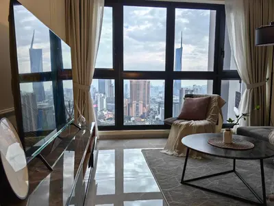 a living room with a view of a city at TRX Agile Bukit Bintang Boutique 2 Bedroom and 1 Living Room Suites in Kuala Lumpur