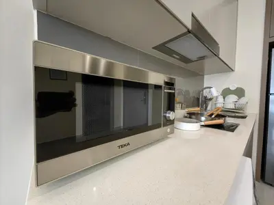 a microwave oven on a counter in a kitchen at TRX Agile Bukit Bintang Boutique 2 Bedroom and 1 Living Room Suites in Kuala Lumpur