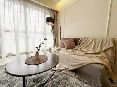 a living room with a couch and a table at TRX Agile Bukit Bintang Boutique 2 Bedroom and 1 Living Room Suites in Kuala Lumpur