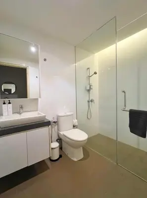 a bathroom with a toilet and a sink and a shower at The Establishment Bangsar #23a by Ouki in Kuala Lumpur