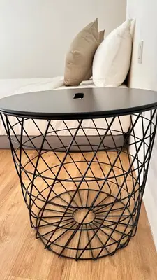 a black coffee table with pillows on a bed at The Establishment Bangsar #2222 by Ouki in Kuala Lumpur