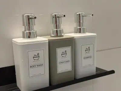 a trio of soap wizards sitting on a shelf at The Establishment Bangsar #2222 by Ouki in Kuala Lumpur