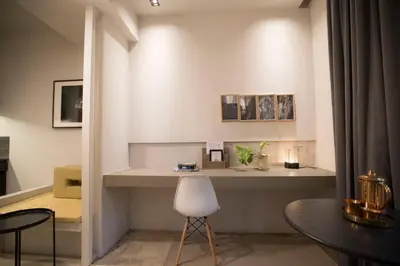 a room with a desk and a table and a chair at M1- room w planter box in Kuala Lumpur