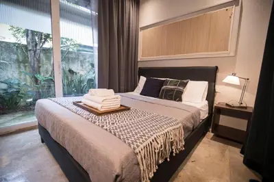 a bedroom with a bed with a large window at M1- room w planter box in Kuala Lumpur