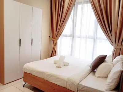 a bedroom with a bed with a large window at TRION Luxury City Suites Near KLCC & TRX in Kuala Lumpur