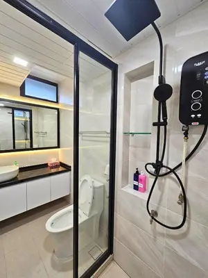 a bathroom with a shower with a toilet and a camera at Fahrenheit 88 - Bukit Bintang in Kuala Lumpur