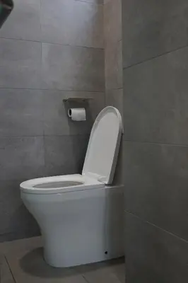 a bathroom with a toilet with the lid up at Rivera City, KL Sentral Studio Apartment in Kuala Lumpur