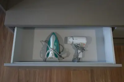 a shelf with a fish and a surfboard on it at Rivera City, KL Sentral Studio Apartment in Kuala Lumpur