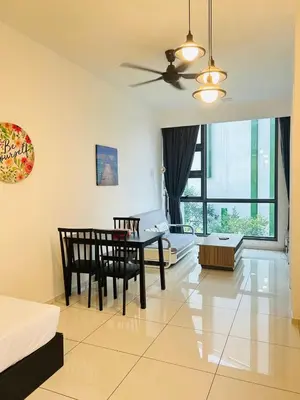 a living room with a table and a dining room at Robertson Suites At Bukit Bintang Kuala Lumpur in Kuala Lumpur