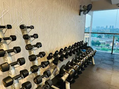 a room with a wall full of wine racks at D'Majestic Place by Roomy in Kuala Lumpur