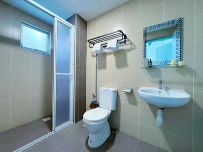 a bathroom with a toilet and a sink at Razak City Fully Air-Con Suite Sungai Besi Kuala Lumpur 57100 in Kuala Lumpur