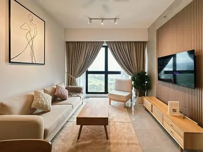 a living room with a couch and a tv at Agile Bukit Bintang TRX KL by Lilbean Space - 2B1R in Kuala Lumpur