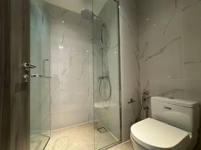 a bathroom with a glass shower with a toilet at Agile Bukit Bintang TRX KL by Lilbean Space - 2B1R in Kuala Lumpur