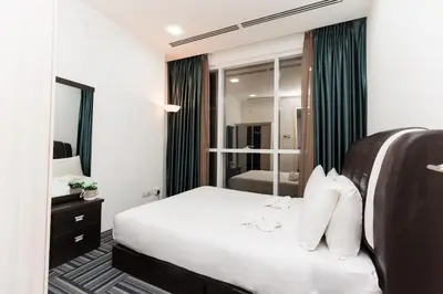 a hotel room with a bed and a mirror at Binjai 8 Signature by PSM in Kuala Lumpur