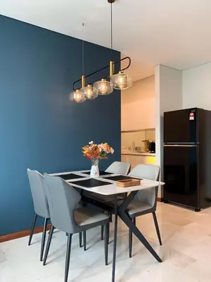 a dining room with a black table and chairs at Sky suites KLCC Level 58, 600Mbps WiFi - 2R plus 1BB in Kuala Lumpur