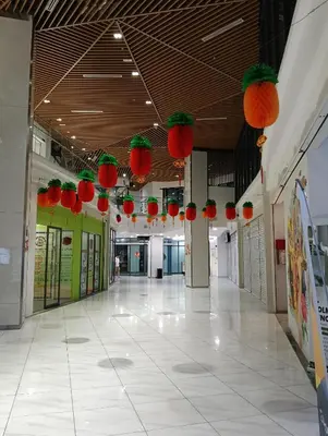 an empty hallway of a building with lanterns on the ceiling at Colony by infinitum KLCC in Kuala Lumpur