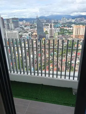 a balcony with a view of a city at Colony by infinitum KLCC in Kuala Lumpur
