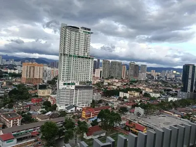 a view of a city with a tall building at Colony by infinitum KLCC in Kuala Lumpur