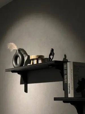 a shelf with a book and some items on it at Luxury Black Suite Agile Bukit Bintang in Kuala Lumpur