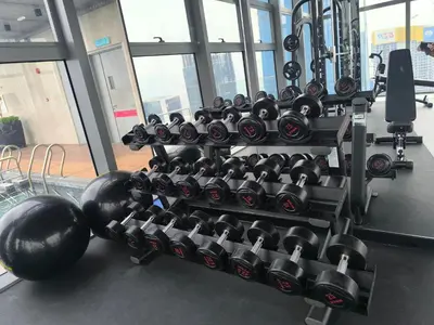 a rack of dumbbells in a gym at AXON Residence Near TRX & Pavilion KL in Kuala Lumpur