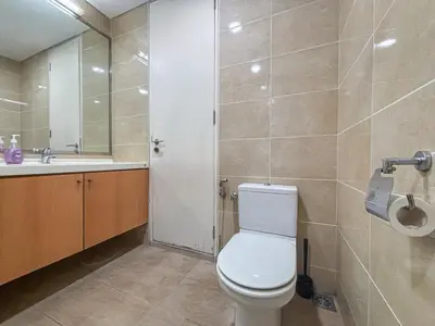a bathroom with a toilet and a sink at Bintang Goldhill, 5M to TRX in Kuala Lumpur