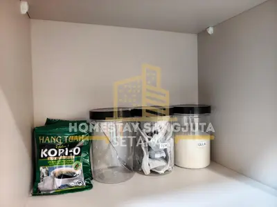 a shelf with two containers and a box on it at Homestay SANGJUTA Setapak - Kid Friendly in Kuala Lumpur