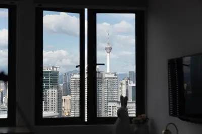 a view of the seattle skyline from a window at Cozy Studio l Riveria City l 1km to KL Sentral in Kuala Lumpur