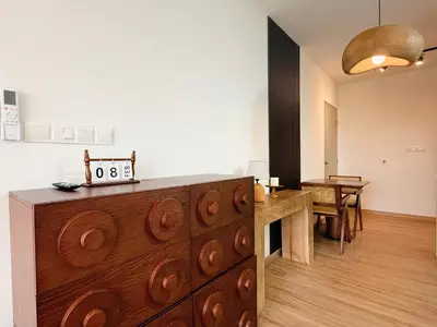 a room with a wooden dresser and a dining room at Cozy Studio l Riveria City l 1km to KL Sentral in Kuala Lumpur